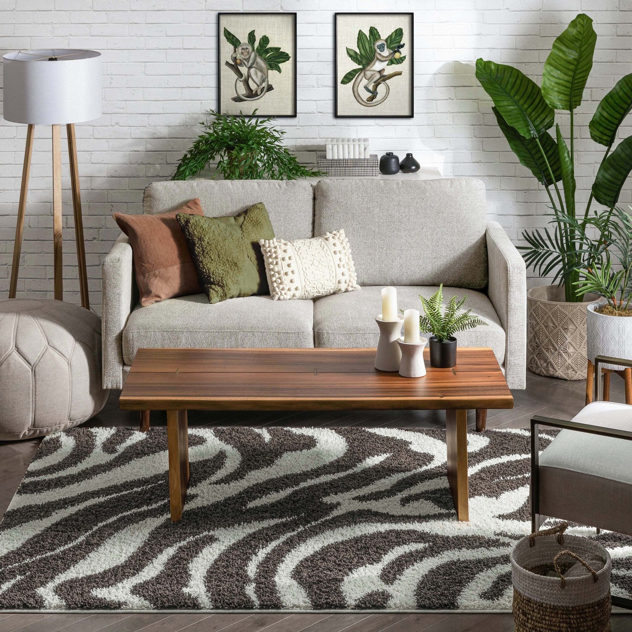 Safari Zebra Brown Contemporary Shag Rug - Well Woven - A plush zebra rug grounding a modern, bohemian-style living space with art prints and neutral seating.