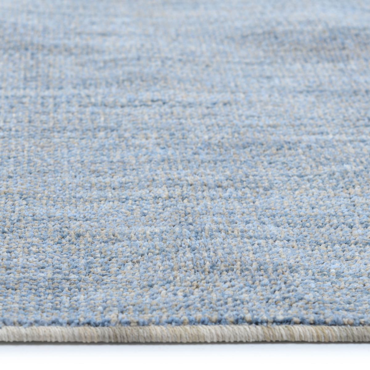 COD-17 Well Woven Moor Washable Rug: Close-up of a textured blue washable rug with a subtle oatmeal pattern.