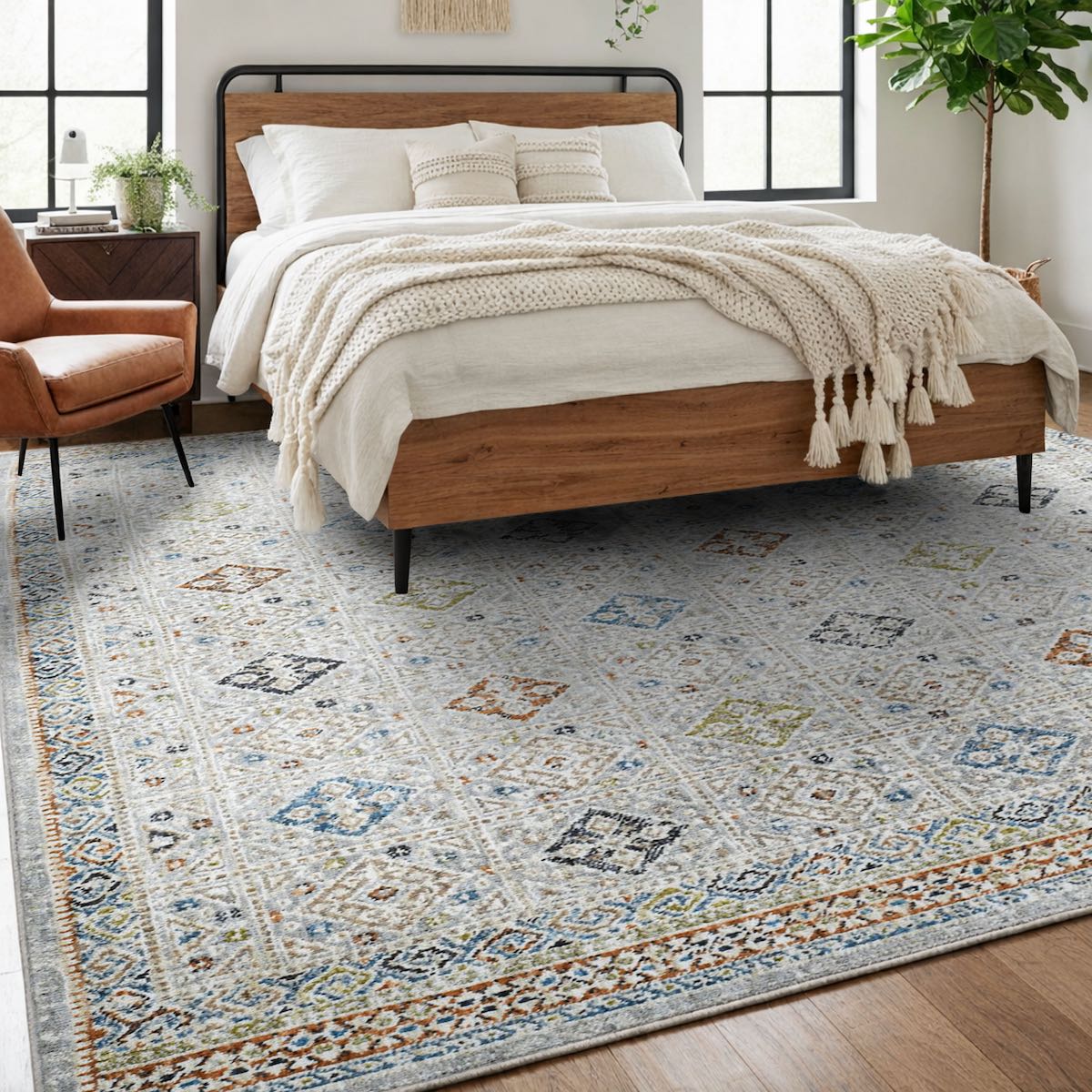 COD-21 Well Woven Mere Washable Rug - Bedroom with a wooden bed, white bedding, and a patterned tribal rug.