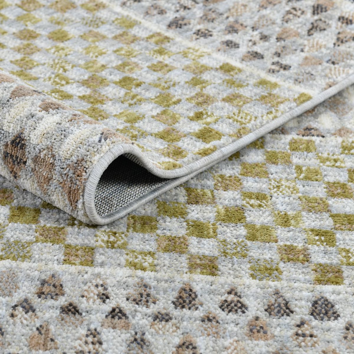 COD-31 Well Woven Wynn Washable Rug: A close up of the modern tribal rug design in green, peach, and light grey colors.