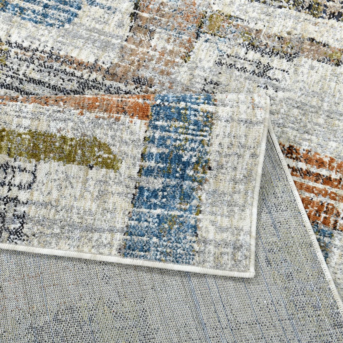 COD-51 Well Woven Fen Washable Rug: Close up of. the multicolored area rug with soft, abstract pattern