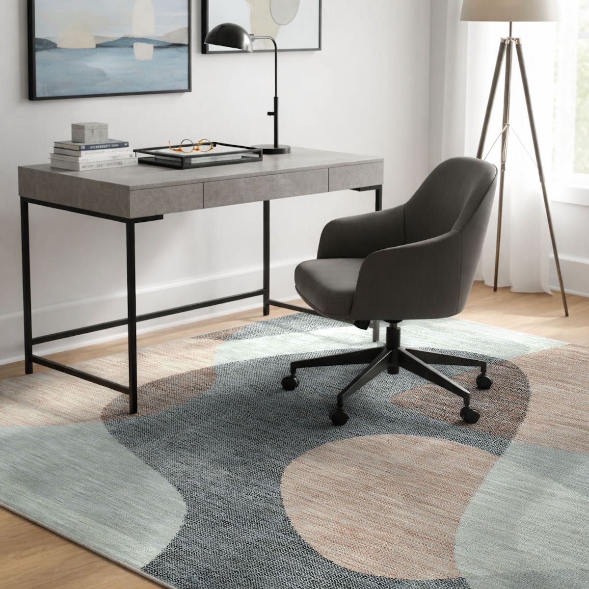 COD-60 Well Woven Holt Washable Rug - Modern office setup with a desk and chair on a patterned abstract rug.The office rug is peach, light grey and dark grey and features free-flow abstract shapes.