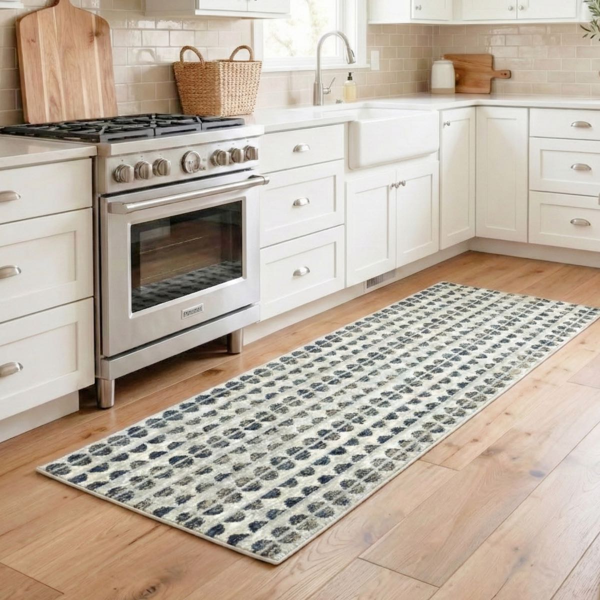 COD-81 - Modern kitchen with white cabinets, stainless steel oven, and a patterned washable runner rug on the floor.