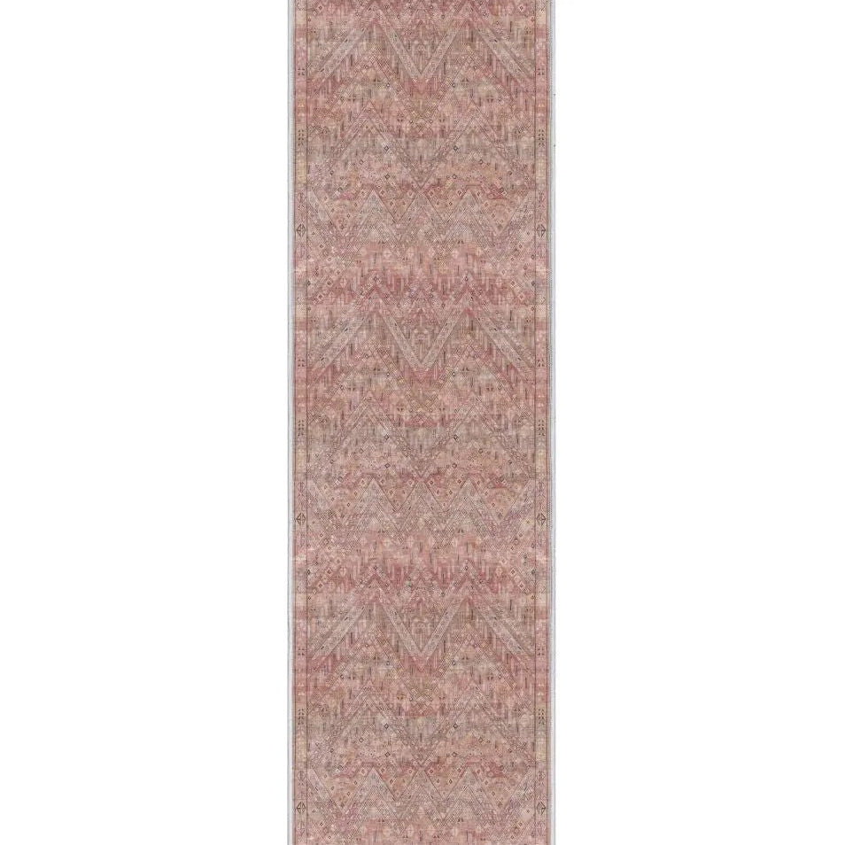 Pink rectangular runner rug with a tribal chevron stripe pattern on a white background. The rug is the Asha Anya custom size runner from Well Woven