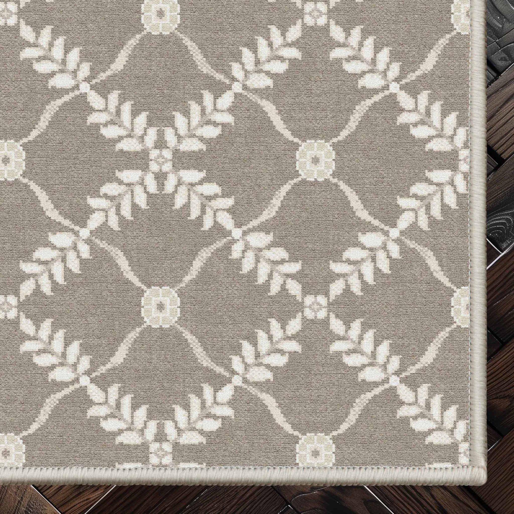 Well Woven - Aldwyn Beige Custom Rug - rug corner on dark wood floor