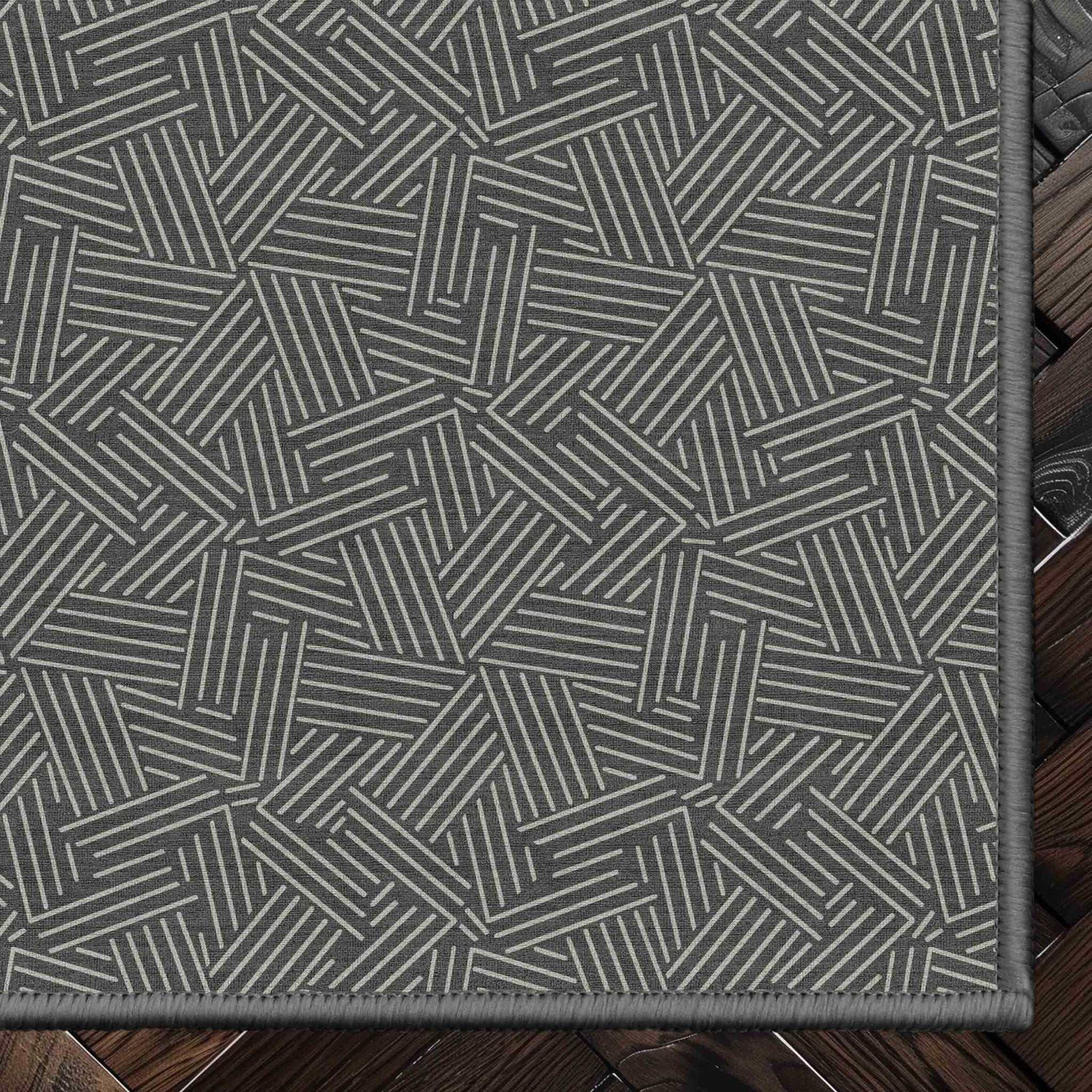 Sigrid Custom Rug - Well Woven - Grey geometric rug corner on a dark wood floor