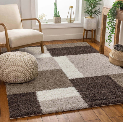 Cubes Beige Brown Modern Geo Rug - Well Woven - A modern shag rug with a bold geometric checkered pattern in shades of dark brown, ivory, and taupe, styled in a cozy living room with wooden floors and neutral furniture.