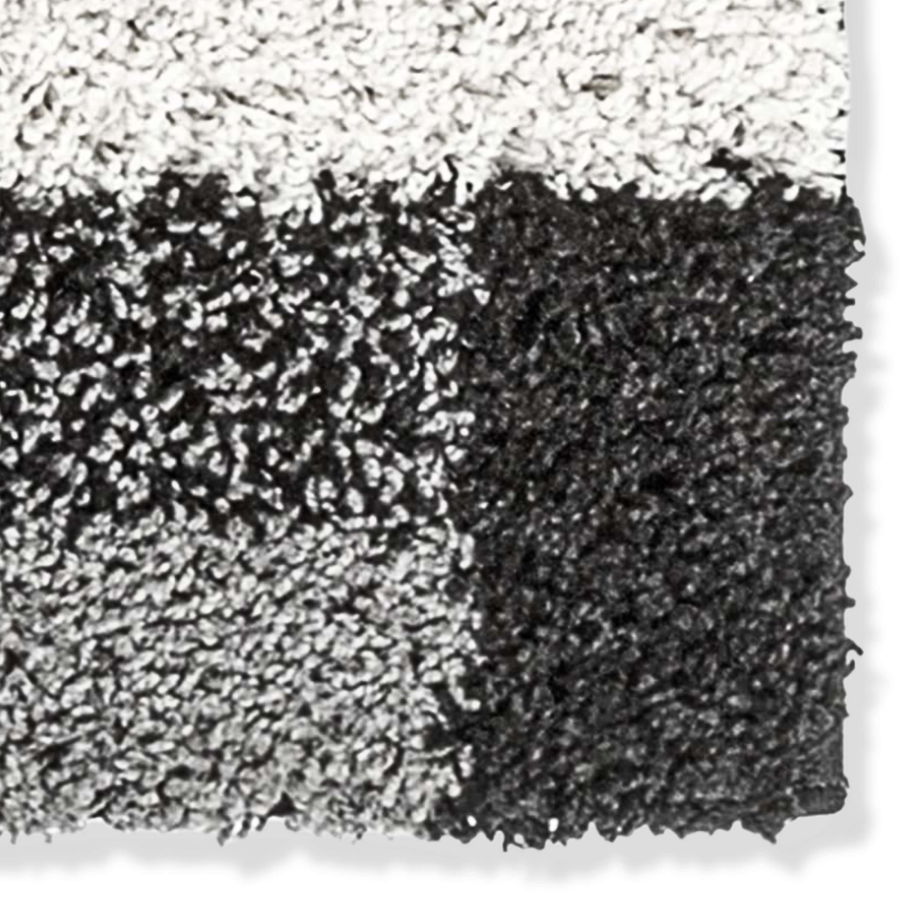 Close-up of black and gray textured shag rug swatch