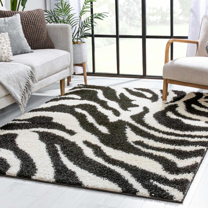 Safari Zebra Black Contemporary Shag Rug - Well Woven - zebra-pattern rug from a side angle, highlighting its dramatic contrast and texture in a sunlit room