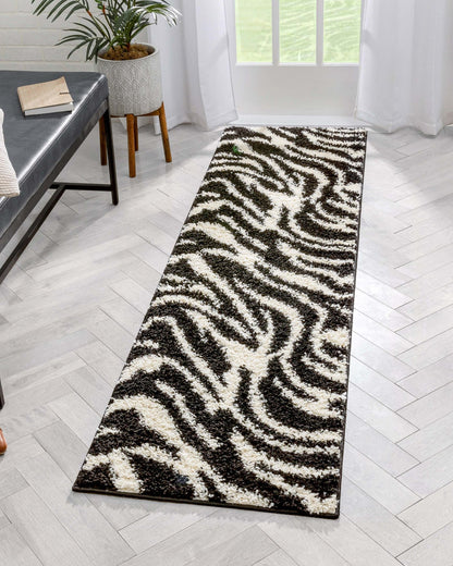 Safari Zebra Black Contemporary Shag Rug - Well Woven - A long zebra-print runner placed along a hallway, emphasizing the rug’s length and eye-catching design.