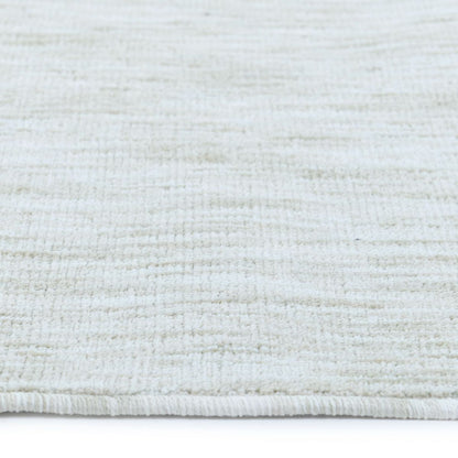 COD-12 Well Woven Moor Washable Rug: Close-up of a textured white rug with a subtle cream pattern on a white background