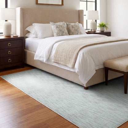 COD-12 Well Woven Moor Washable Rug - Neatly made bed in a bedroom with a plush heathered ivory rug on the floor.