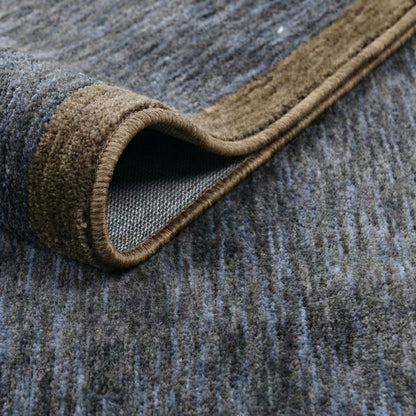 COD-13 - Close-up of a textured steel blue, charcoal, and brown runner rug edge