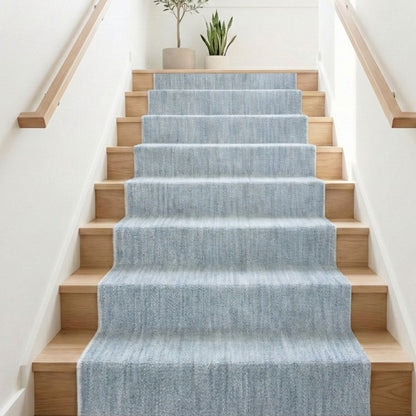 COD-17 - Staircase with a washable blue runner and wooden steps, featuring potted plants.