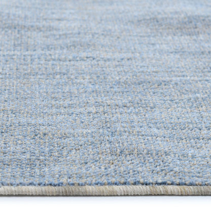 COD-17 Well Woven Moor Washable Rug: Close-up of a textured blue washable rug with a subtle oatmeal pattern.