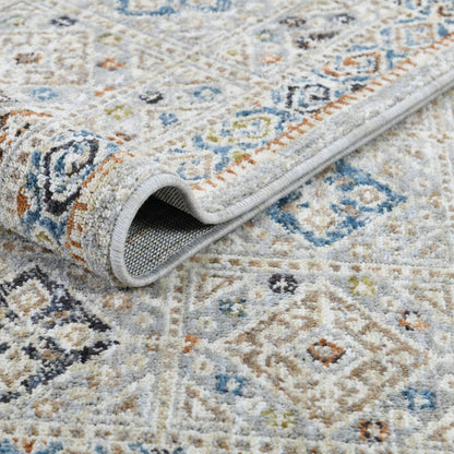COD-21 Well Woven Mere Washable Rug: Patterned multicolor rug folded over itself, showing texture and design details.