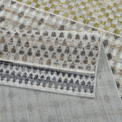 The COD-31 Well Woven Wynn Washable Rug folded over itself to show its soft pile surface, gentle backing, and dimensional color palette