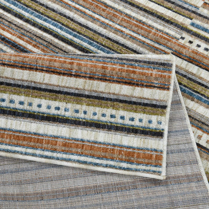 COD-41 Well Woven Thane Washable Rug: Close-up of a striped rug folded over itself to highlight its with brown, blue, and beige colors.