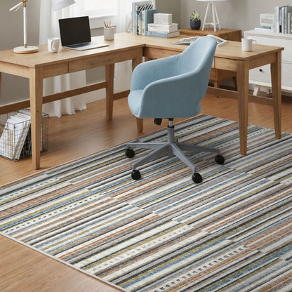 COD-41 Well Woven Thane Washable Rug - Home office with wooden L-shaped desk, blue chair with wheels, and a multicolor striped rug.