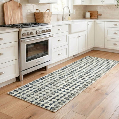 COD-81 - Modern kitchen with white cabinets, stainless steel oven, and a patterned washable runner rug on the floor.