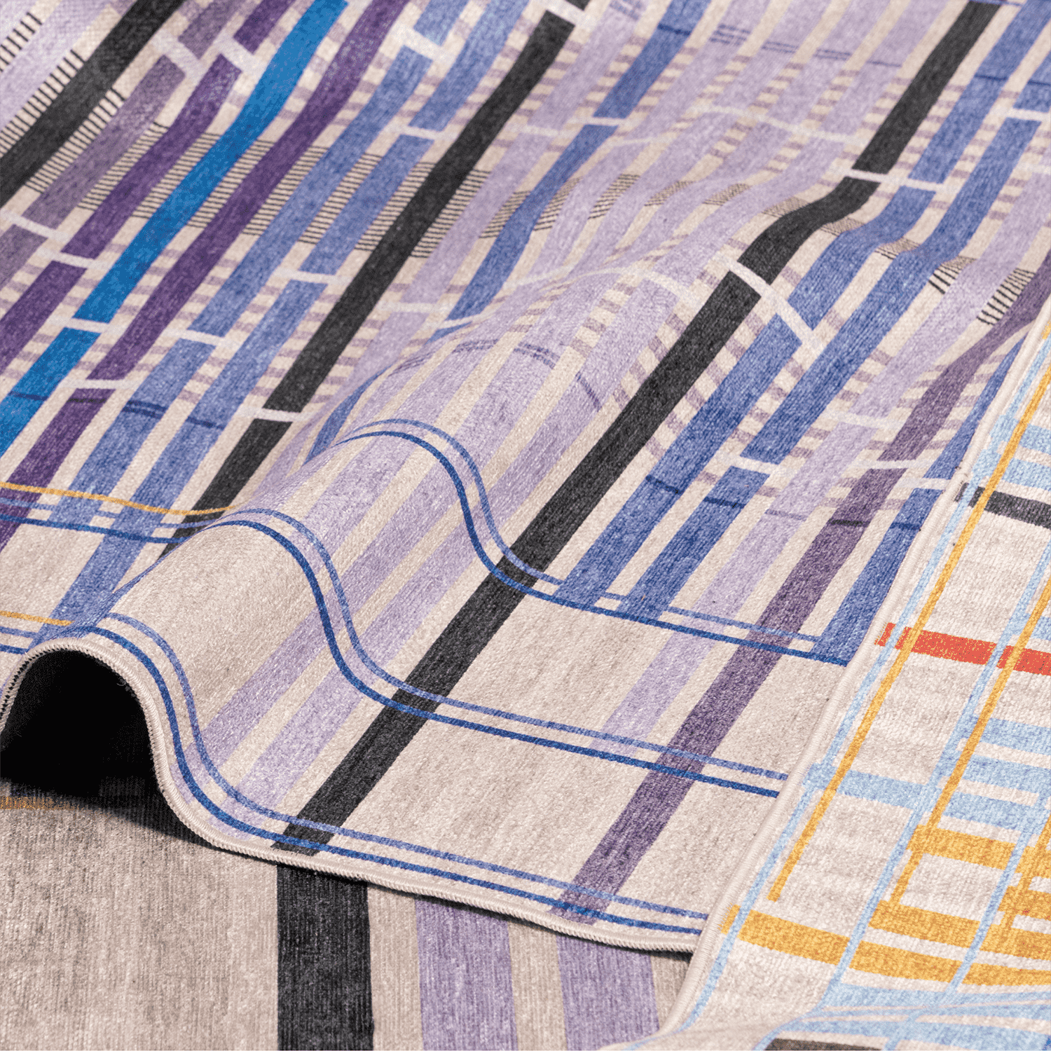 Close-up of Unraveling Stories, acolorful geometric-patterned rug with blue, purple, black, and yellow lines.
