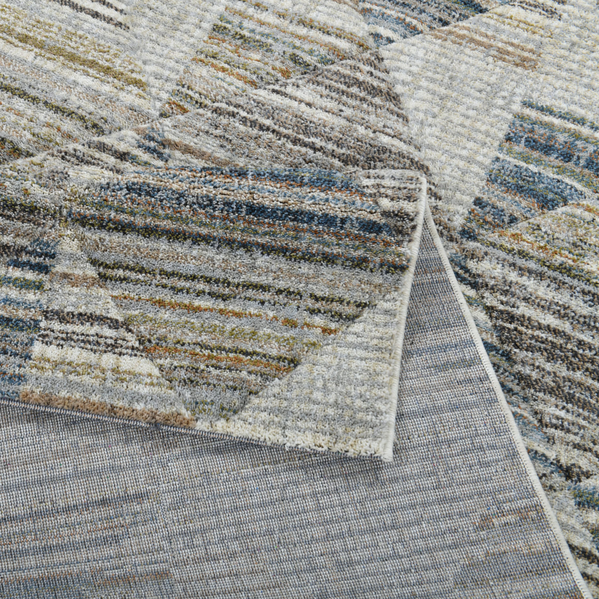ELM-11 Well Woven Knoll Washable Area Rug - A textured washable area rug with a pattern of striped triangles in various colors
