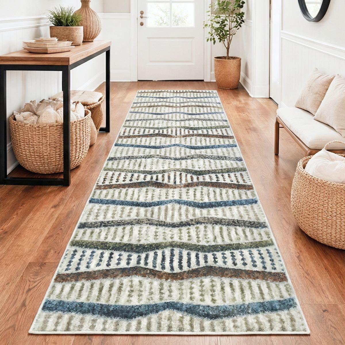 ELM-21 - Patterned runner rug on a wooden floor in a entryway with wicker baskets and a wooden table.