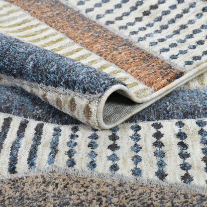 Close-up of the Well Woven Ridge Washable Area Ru with blue, brown, and beige colors.