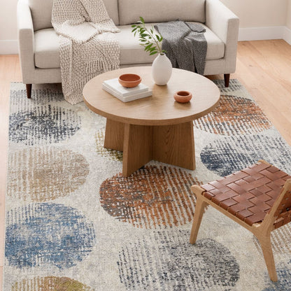ELM-31 Well Woven Vale Washable Area Rug: Living room with a dot patterned rug, wooden coffee table, and chair.