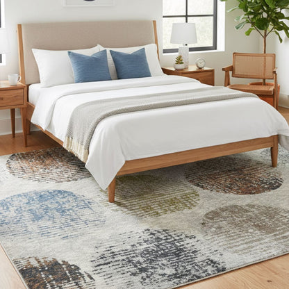 ELM-31 Well Woven Vale Washable Area Rug: Bedroom with a wooden bed, white bedding, and a plush washable rug with a distressed dot pattern.