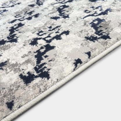 A detail image of the Shadowplay Custom Size Runner Rug abstract rug pattern