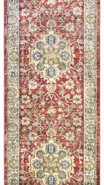IND-130 Decorative rug with intricate patterns in red, beige, and blue on a plain background