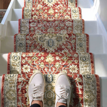 IND-130 Decorative red and beige floral-patterned carpet on a staircase with white shoes at the bottom.
