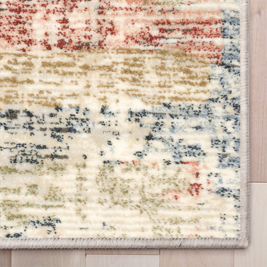 IND-151 Multicolored textured rug on a wooden floor