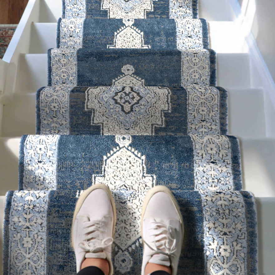 IND-163-R Blue patterned stair runner on a staircase with white sneakers at the bottom.
