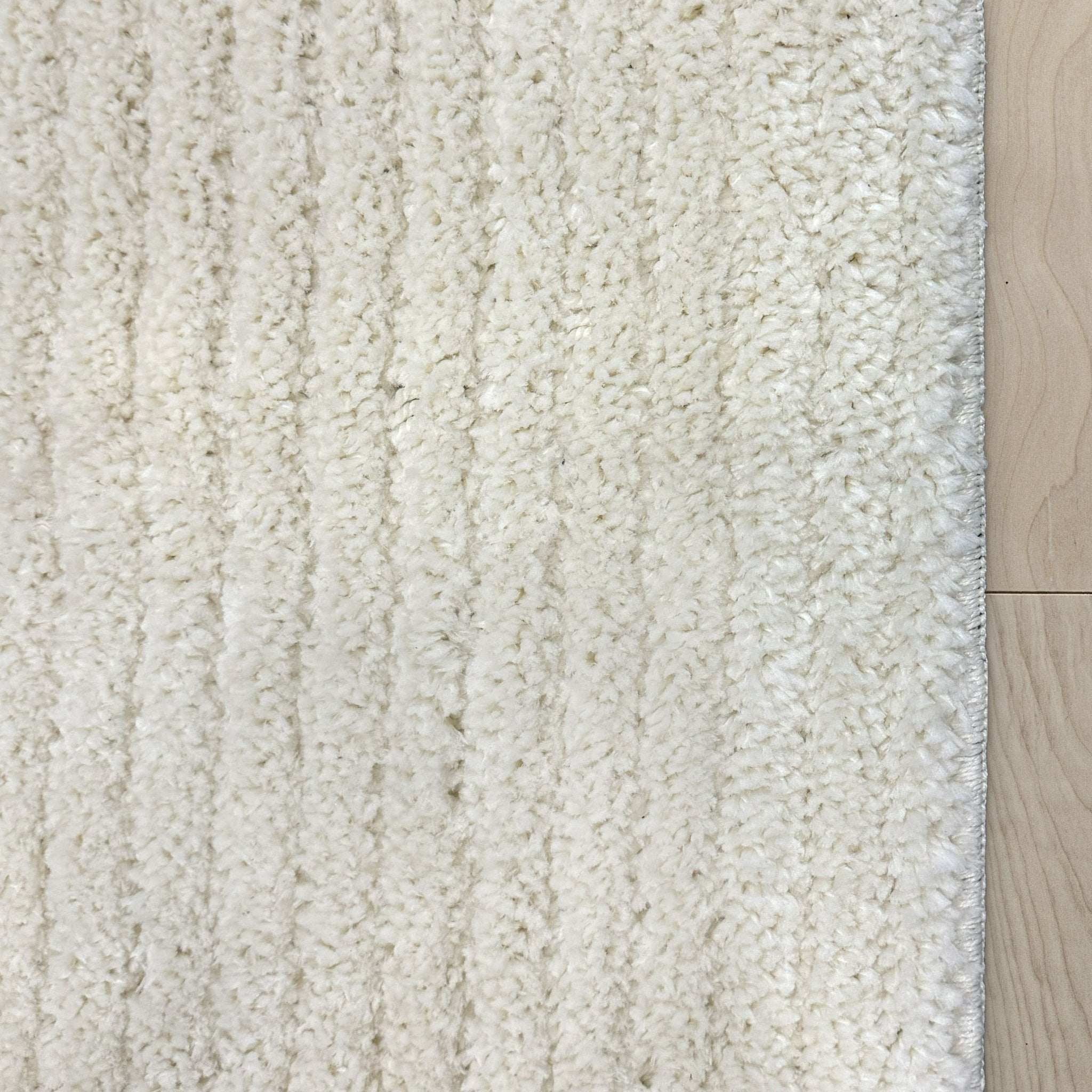 Custom Size Runner Marina Monroe Ivory Hallway Runner Rug - Well Woven - A closeup view of an ivory runner with a shag pile