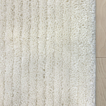 Custom Size Runner Marina Monroe Ivory Hallway Runner Rug - Well Woven - A closeup view of an ivory runner with a shag pile