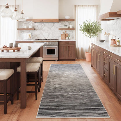 Well Woven modern striped fogstone and pewter runner rug styled in a contemporary kitchen with wood cabinets, marble backsplash, and warm natural lighting.