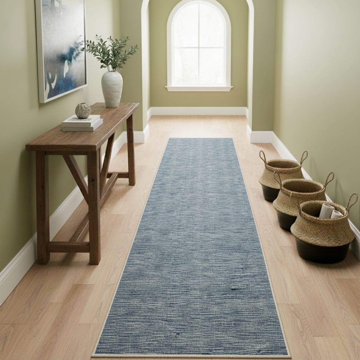 Custom Size Blue Fog Modern Striped hallway runner rug by Well Woven, featuring textured striations, placed in a light wood floor hallway with décor accents.