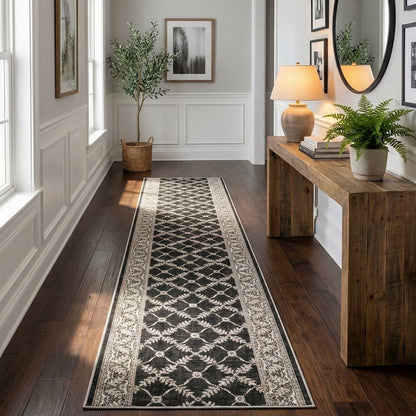 Well Woven Custom Size Regency Lattice Midnight Ash hallway runner rug with a black and cream lattice pattern, styled in a bright hallway with dark wood floors, a rustic console table, and wall art.