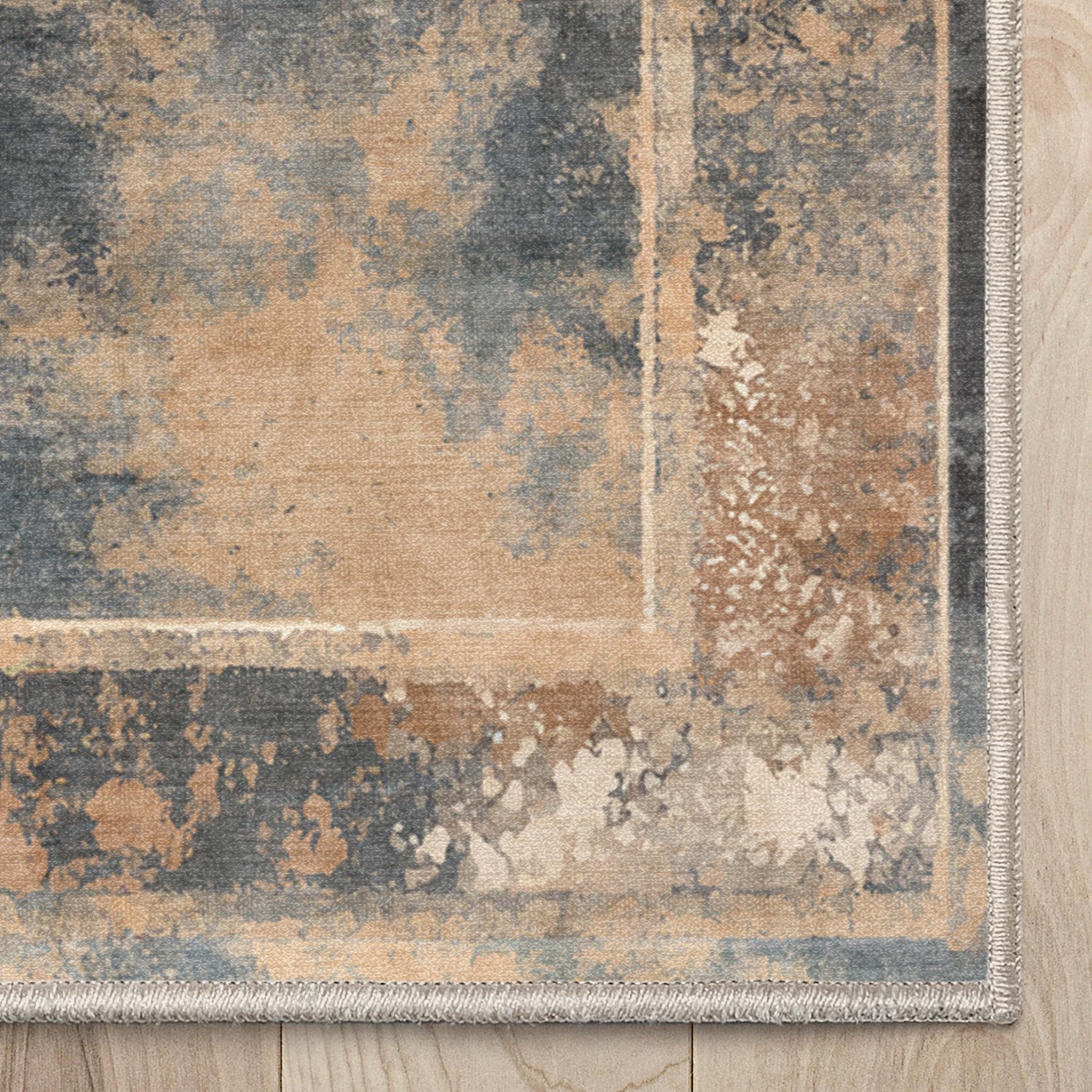 A close up of the Leopard’s Reverie Charcoal & Natural Rug corner