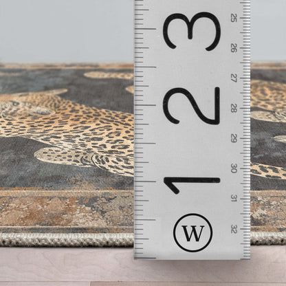 A detail image of the Leopard’s Reverie Charcoal & Natural Rug's profile with a ruler showing the rug's thickness