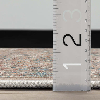 A side profile of the Asha Emilia Flatwoven Custom Runner Rug with a ruler showing measurements on a wooden floor