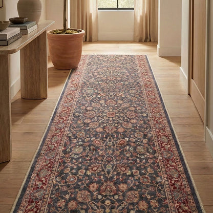 Traditional floral runner rug in entryway with wood floors. The runner is Asha  Rome Navy Blue Red from Well Woven.