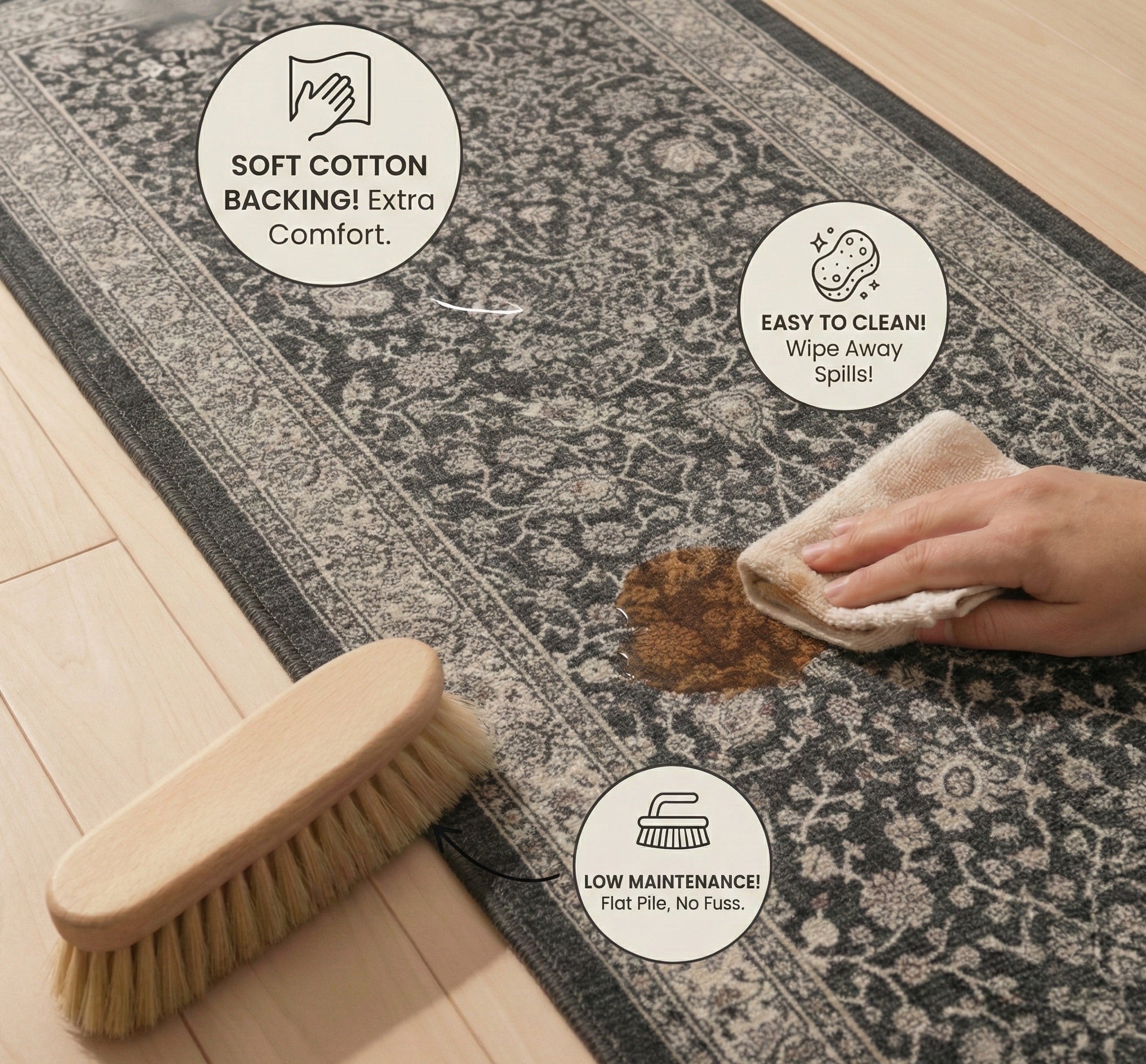 Well Woven Rome Vintage Oriental Floral Black hallway and stair runner rug displayed with cleaning demonstration, showing a wipe removing a spill and feature icons for cotton backing comfort and low-maintenance care.