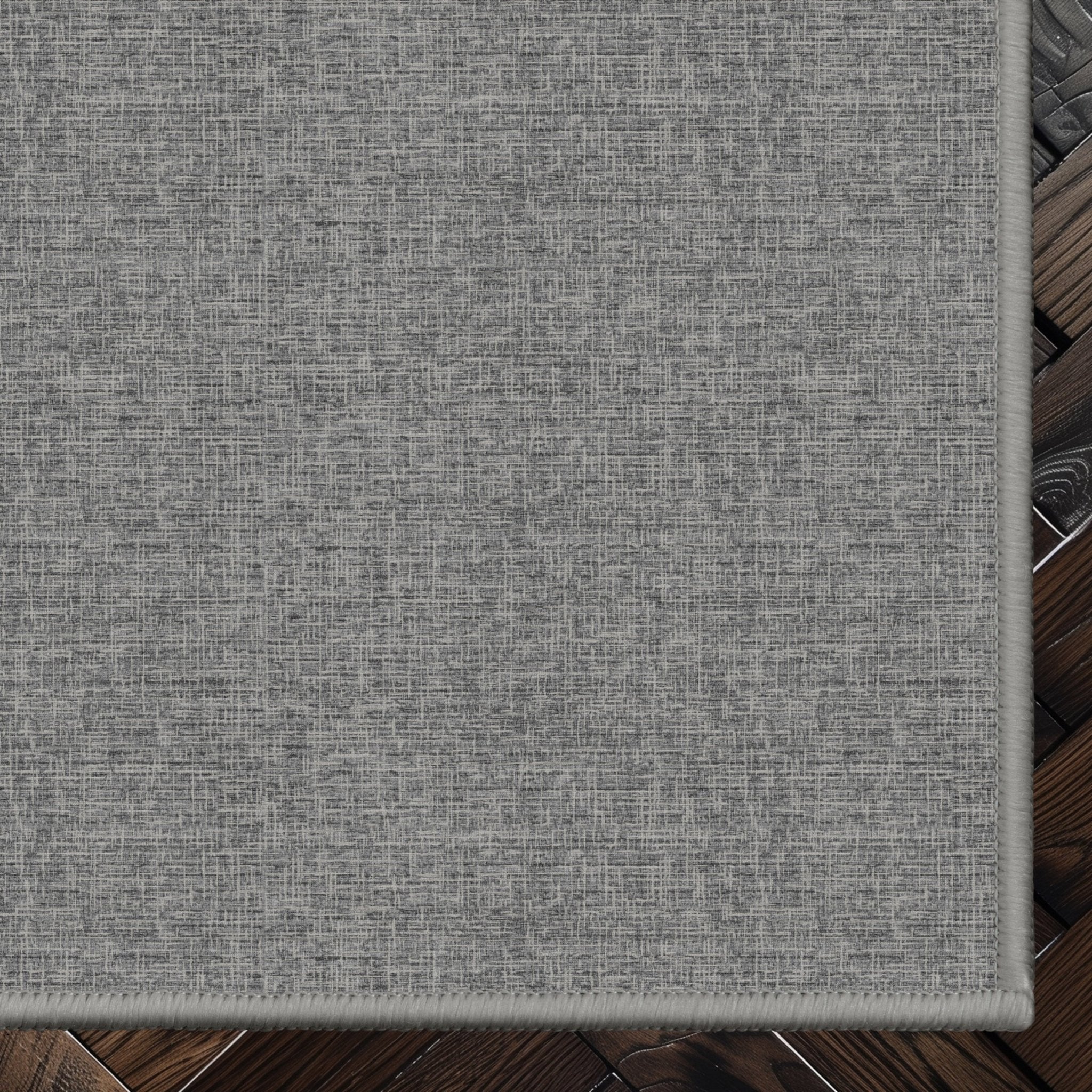 Wilfred Custom Rug - Monochrome Hatch , Low Pile, Easy  Clean, Personalized Sizes - Well Woven - Grey rug corner on a dark wood floor