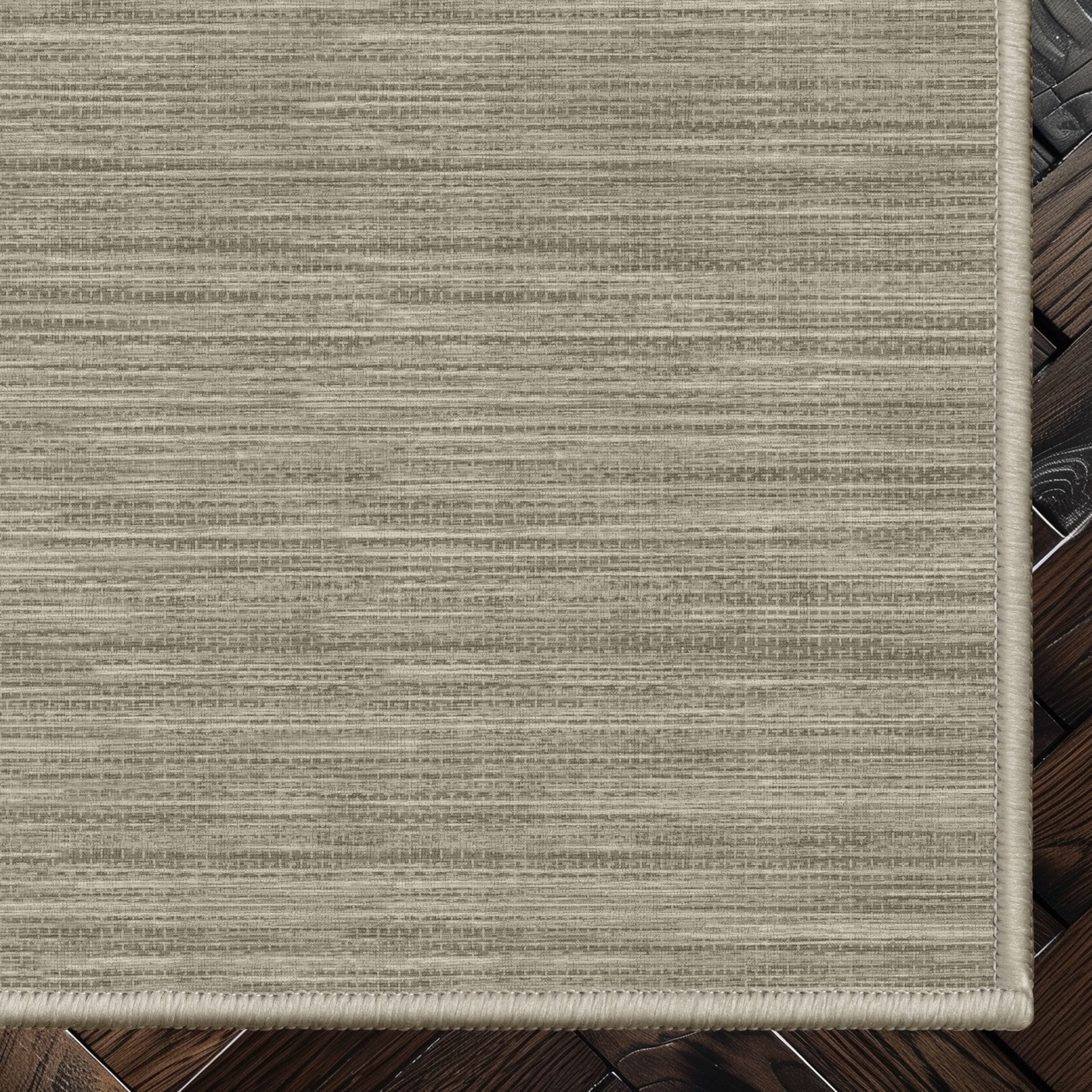 Edwin Custom Rug - Monochrome Striation , Flat Pile, Easy  Clean, Customizable for Your Space - Well Woven - Top-down corner image showing the rug’s smooth, uniform weave and cool beige toned rug color.