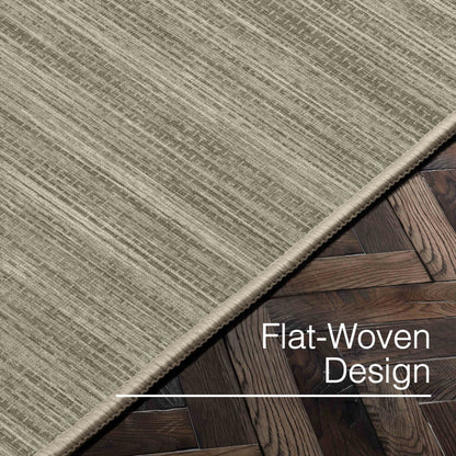 Edwin Custom Rug - Monochrome Striation , Flat Pile, Easy  Clean, Customizable for Your Space - Well Woven - Angled close-up of the beige rug with text: “Flat-Woven Design.”