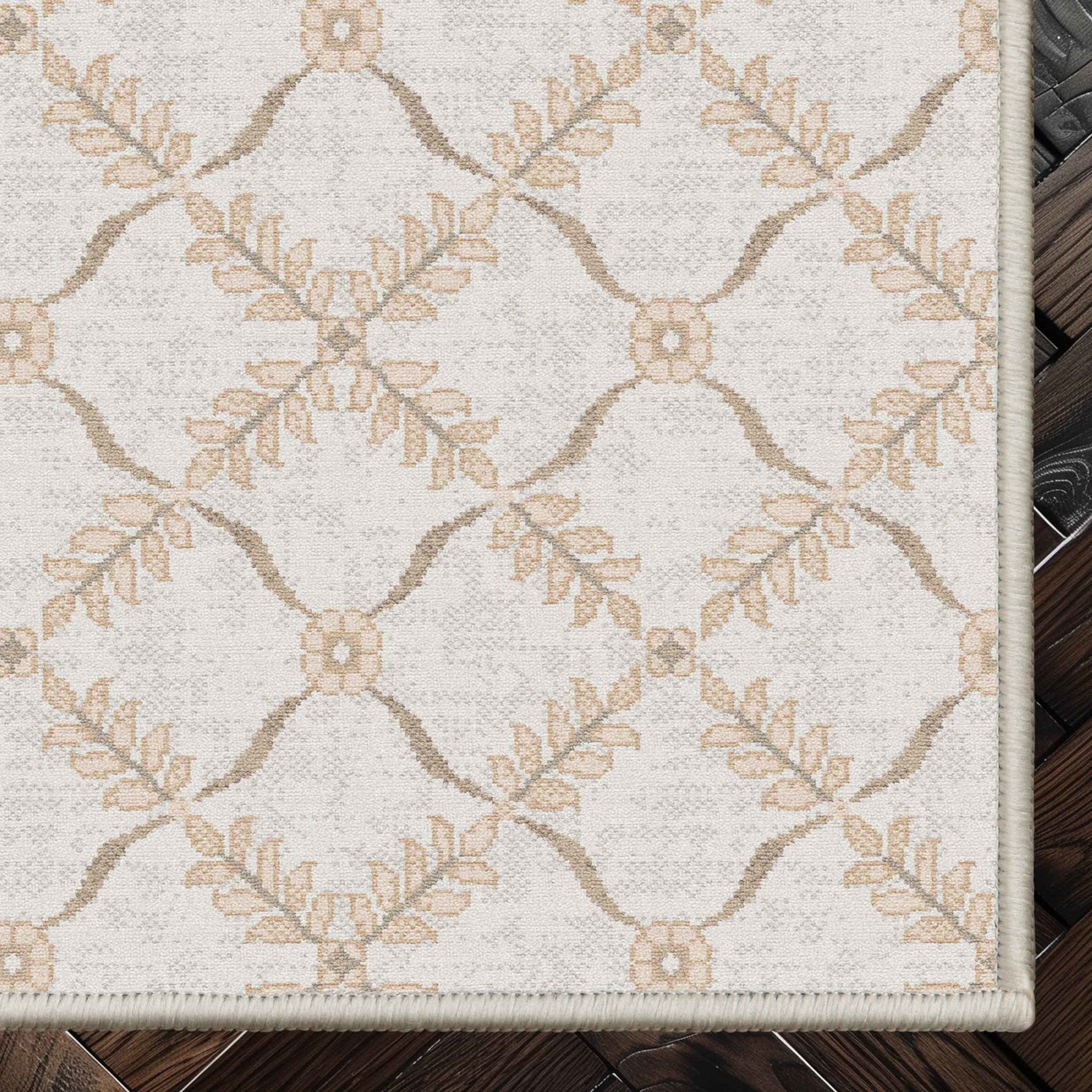 Well Woven - Aldwyn Cream Custom Rug - rug corner on a dark wood floor