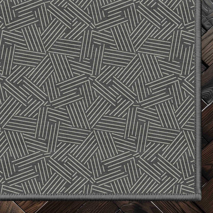 Sigrid Custom Rug - Well Woven - Grey geometric rug corner on a dark wood floor